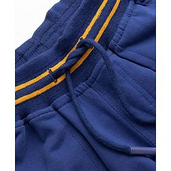 Pine Kids Looper Knit Solid Shorts With Surfing Print - Navy Blue