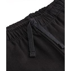 Pine Active Knit Full Length Solid Flared Pant with Logo Print in Black
